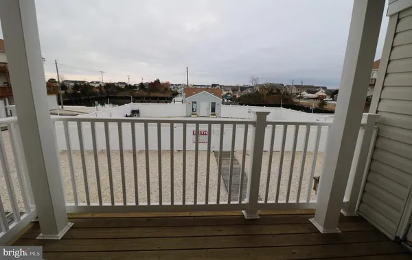a view of balcony with furniture
