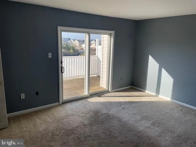 a view of empty room with front door