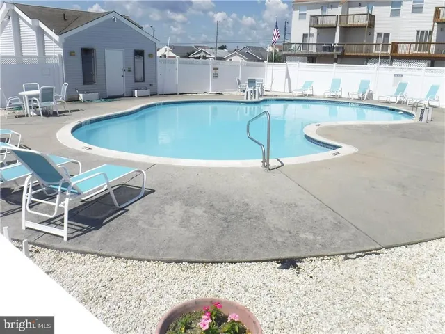 a view of a living room and kitchen