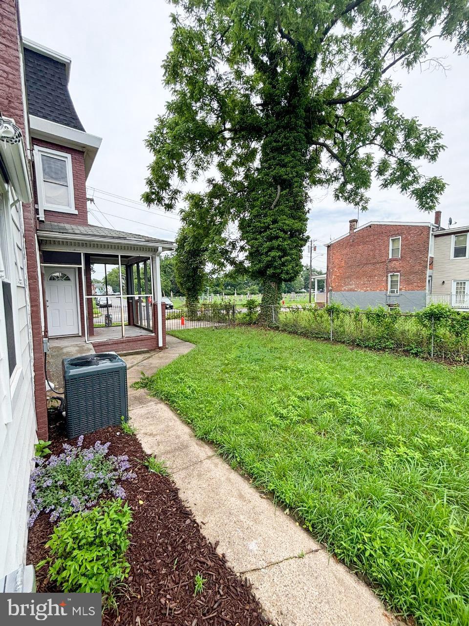 438 Lawrence Street Burlington, NJ 08016 - Photo 16 of 21 Lush green yard with charming pathways.