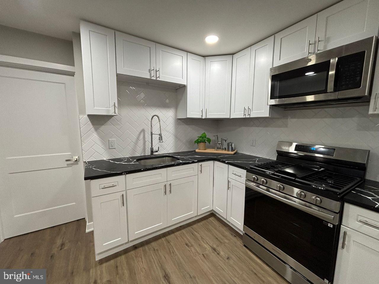 438 Lawrence Street Burlington, NJ 08016 - Photo 5 of 21 Modern kitchen with sleek finishes.