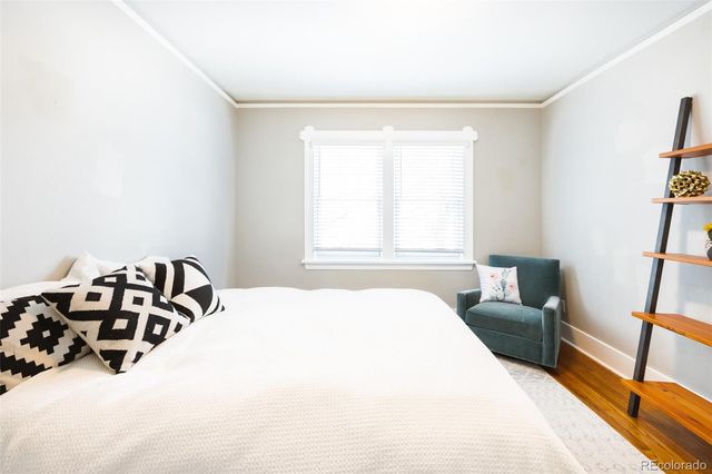 a bedroom with a bed and a couch