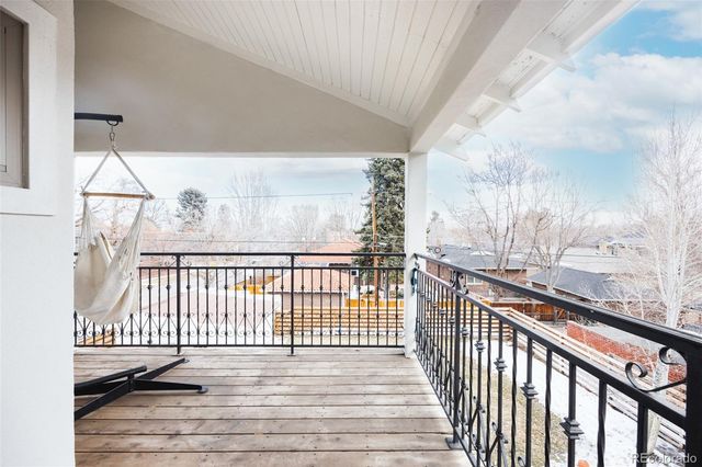 a view of a balcony with wooden floor