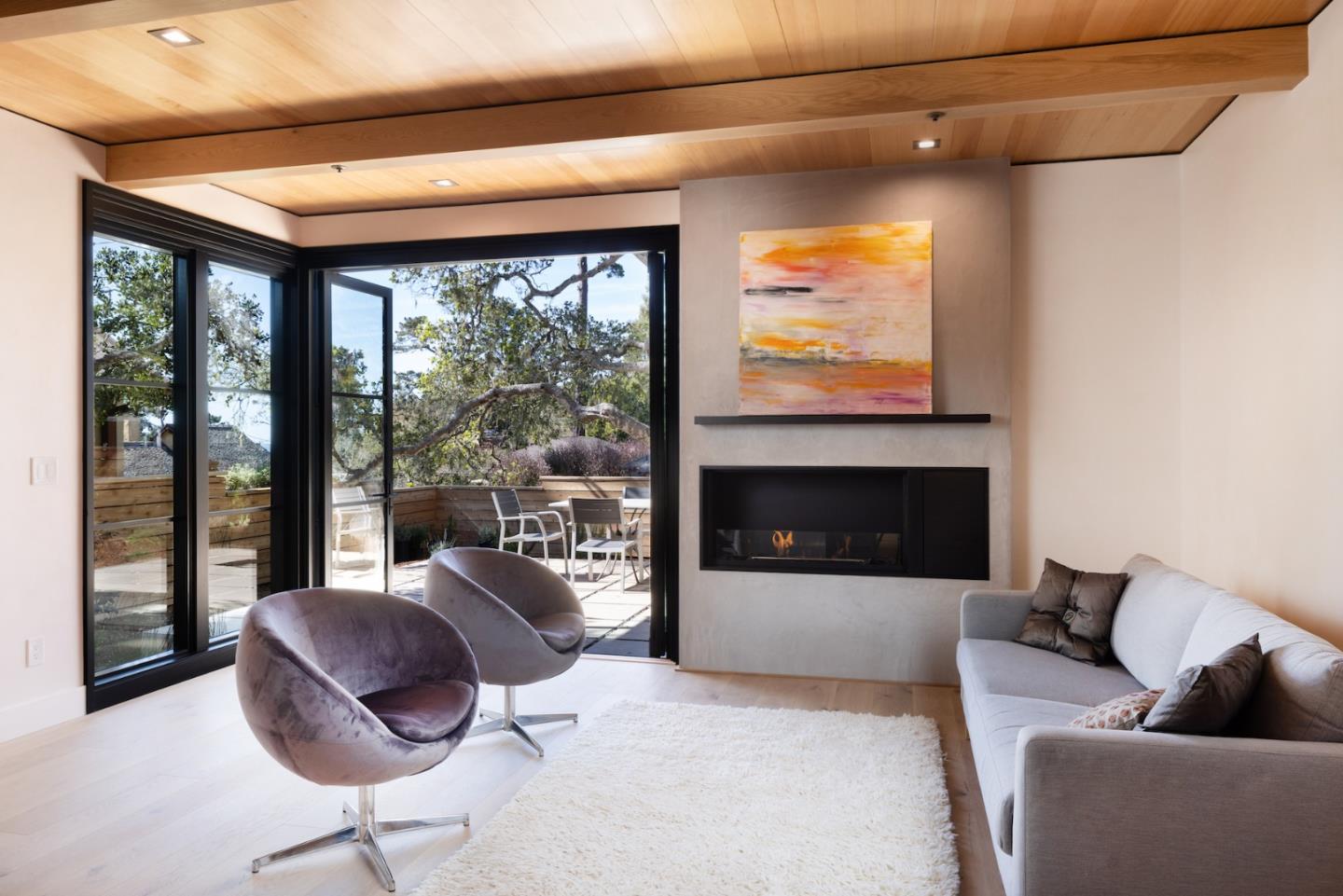 0 Southeast Se Corner Carmel, CA 93921 - Photo 26 of 39 a living room with furniture a floor to ceiling window and a flat screen tv
