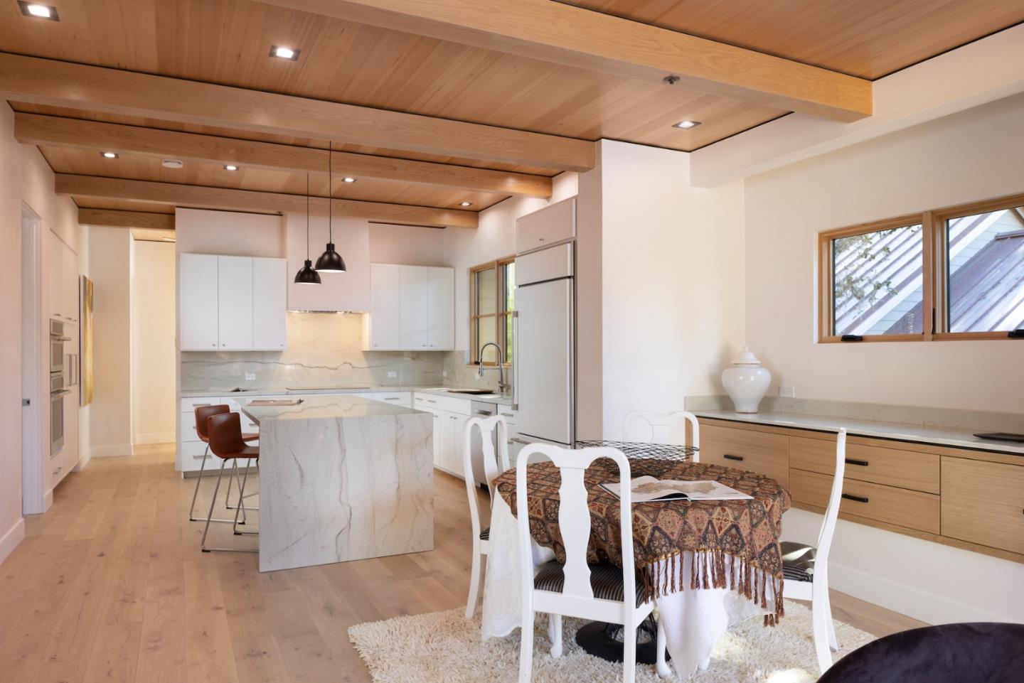 0 Southeast Se Corner Carmel, CA 93921 - Photo 27 of 39 a living room with furniture a dining table and chairs