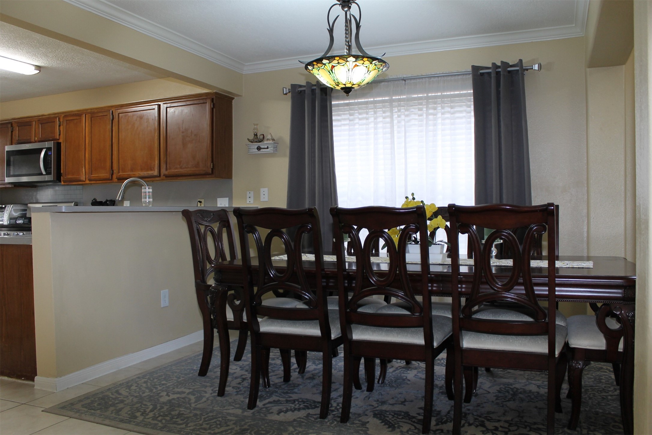 15818 Camp Fire Road Friendswood, TX 77546 - Photo 7 of 36 a view of a dining room with furniture window and outside view