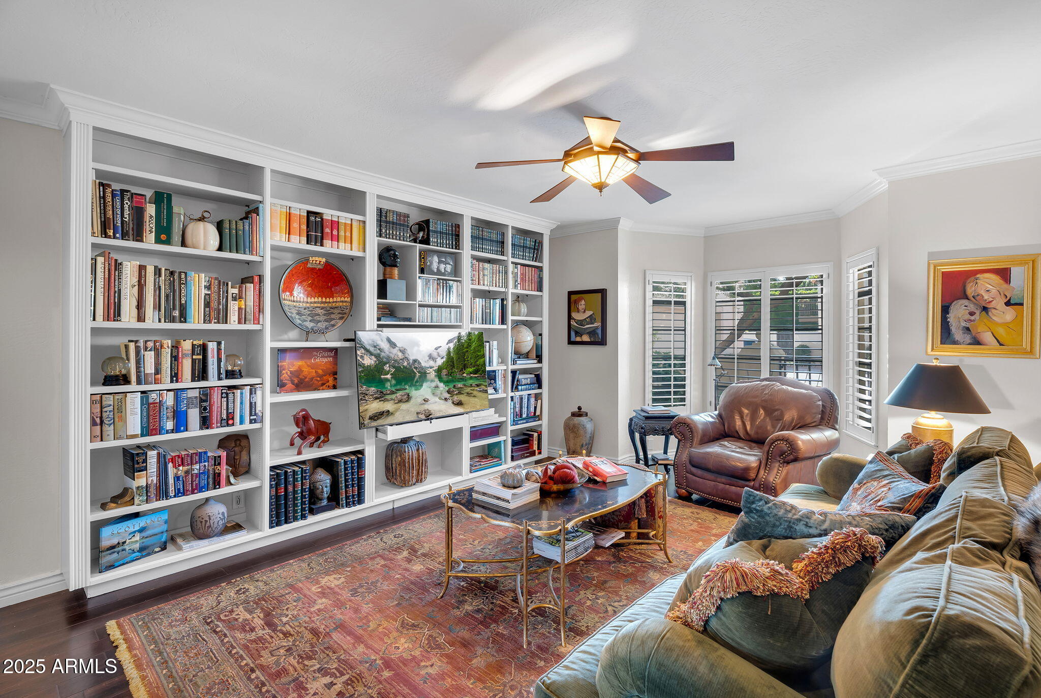 6701 North Scottsdale Road, Unit 16 Scottsdale, AZ 85250 - Photo 24 of 83 a living room with furniture and a book shelf