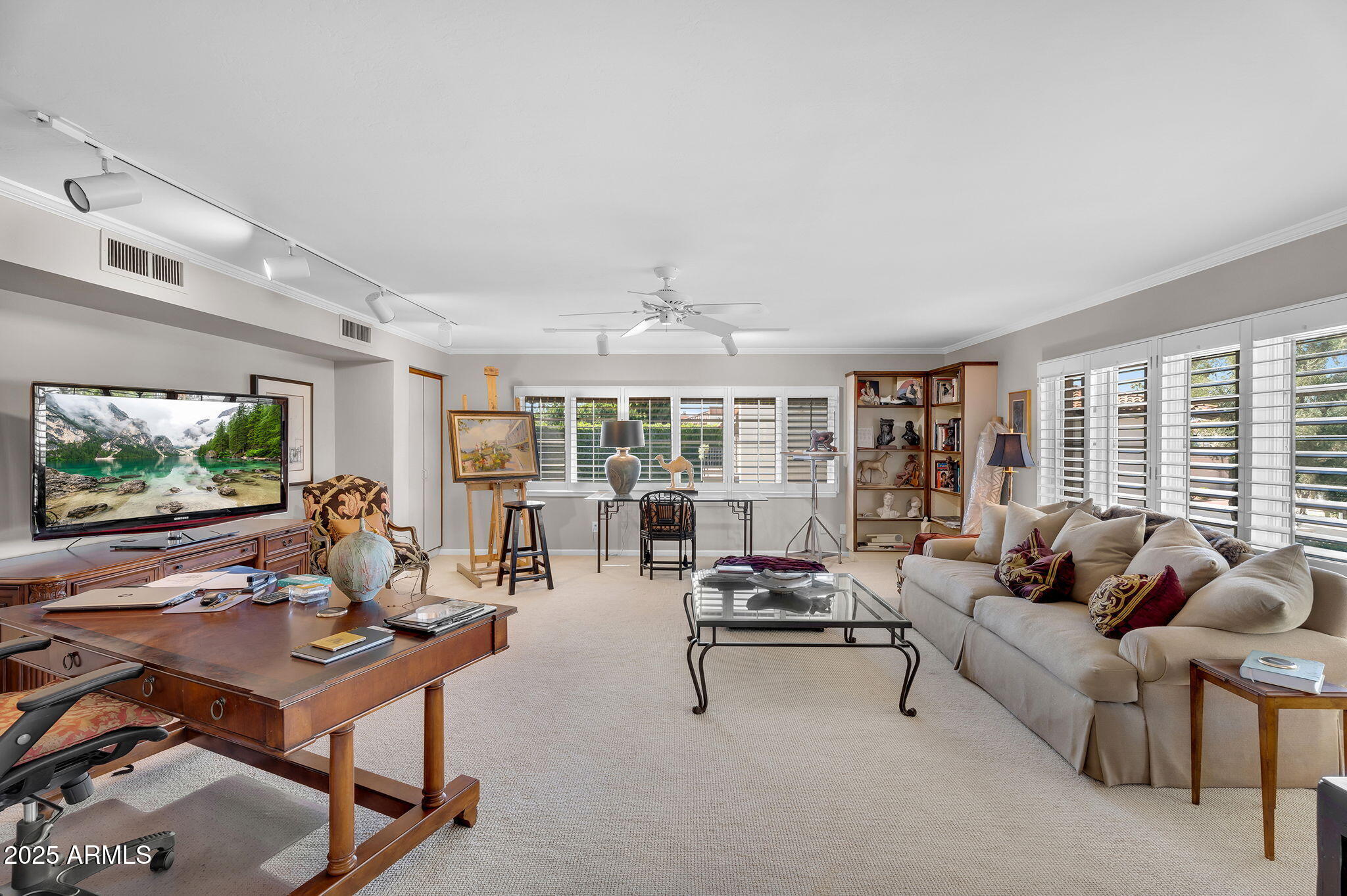 6701 North Scottsdale Road, Unit 16 Scottsdale, AZ 85250 - Photo 31 of 83 a living room with furniture and a flat screen tv