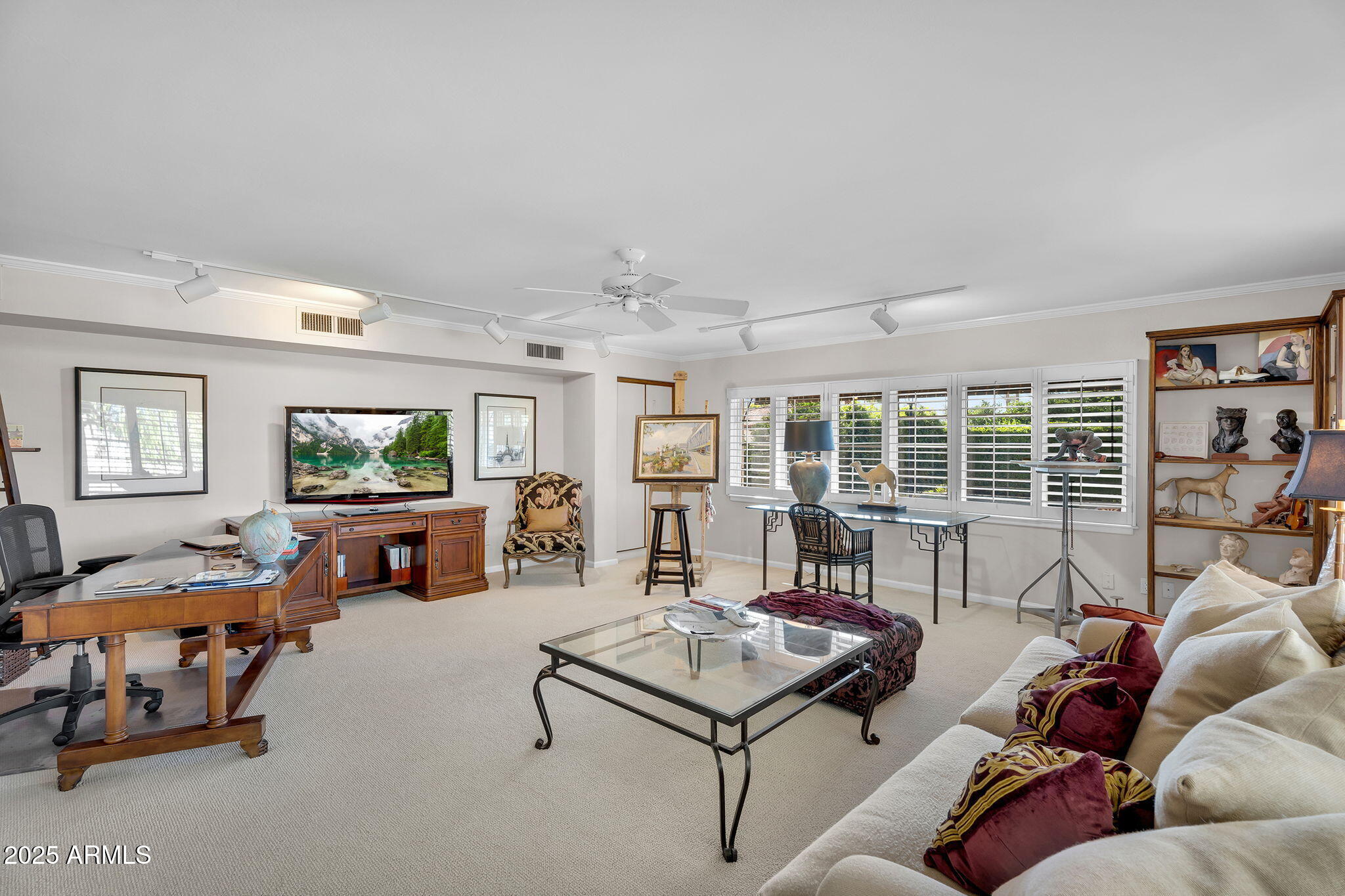 6701 North Scottsdale Road, Unit 16 Scottsdale, AZ 85250 - Photo 32 of 83 a living room with furniture and a flat screen tv