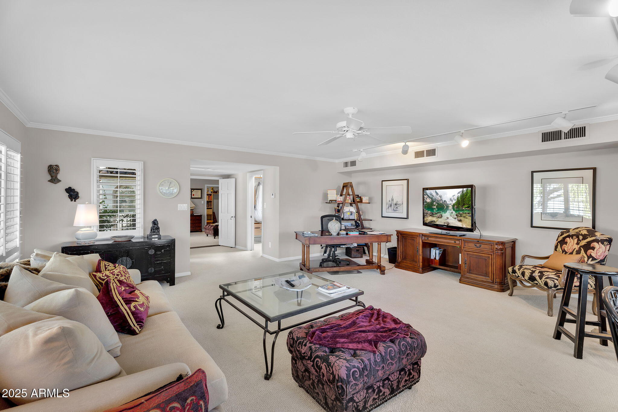 6701 North Scottsdale Road, Unit 16 Scottsdale, AZ 85250 - Photo 33 of 83 a living room with furniture and a flat screen tv