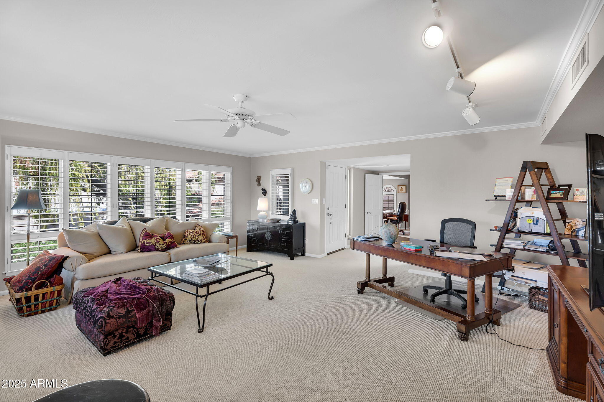 6701 North Scottsdale Road, Unit 16 Scottsdale, AZ 85250 - Photo 34 of 83 a living room with furniture and a large window