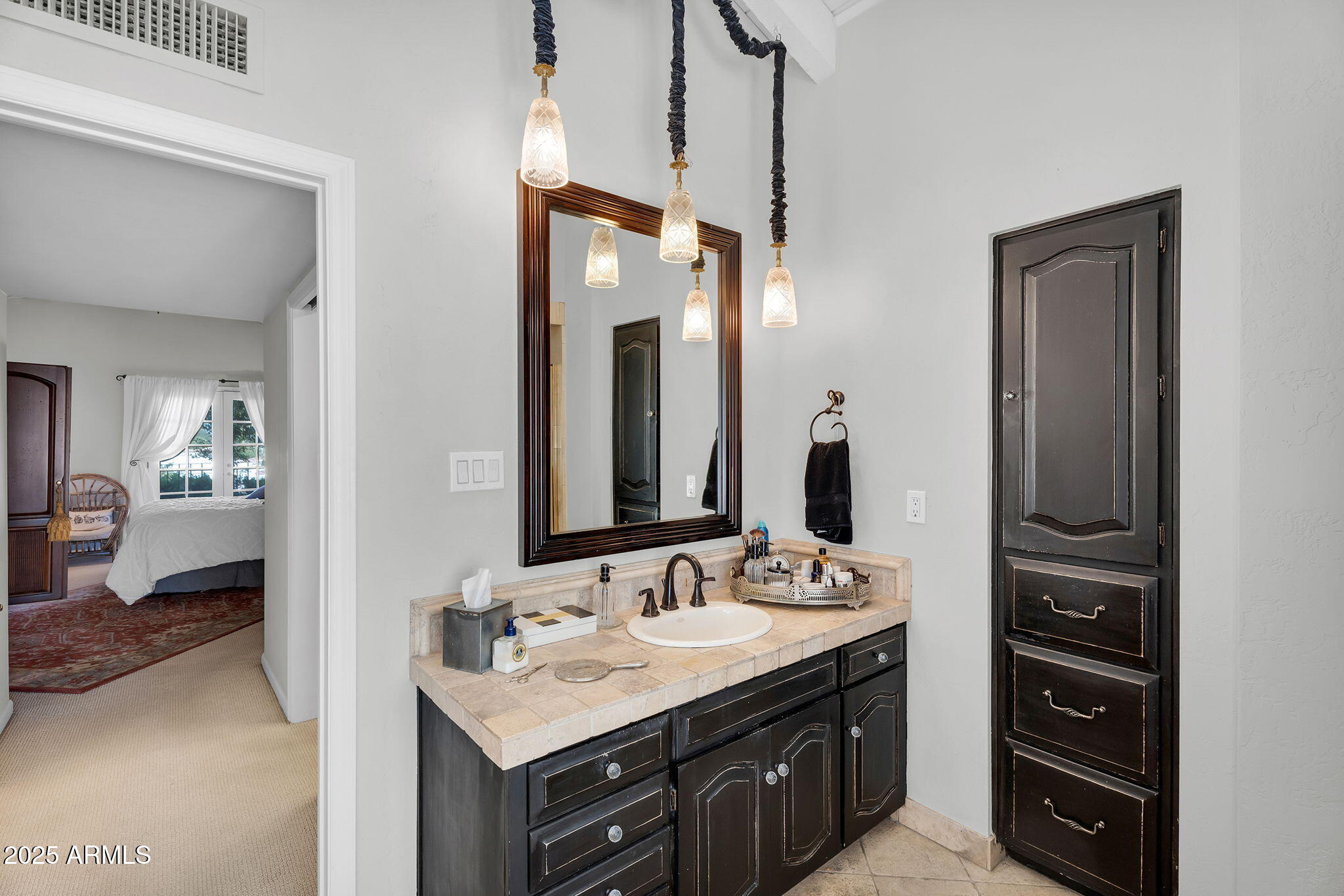 6701 North Scottsdale Road, Unit 16 Scottsdale, AZ 85250 - Photo 50 of 83 a en suite bathroom with a sink and a mirror