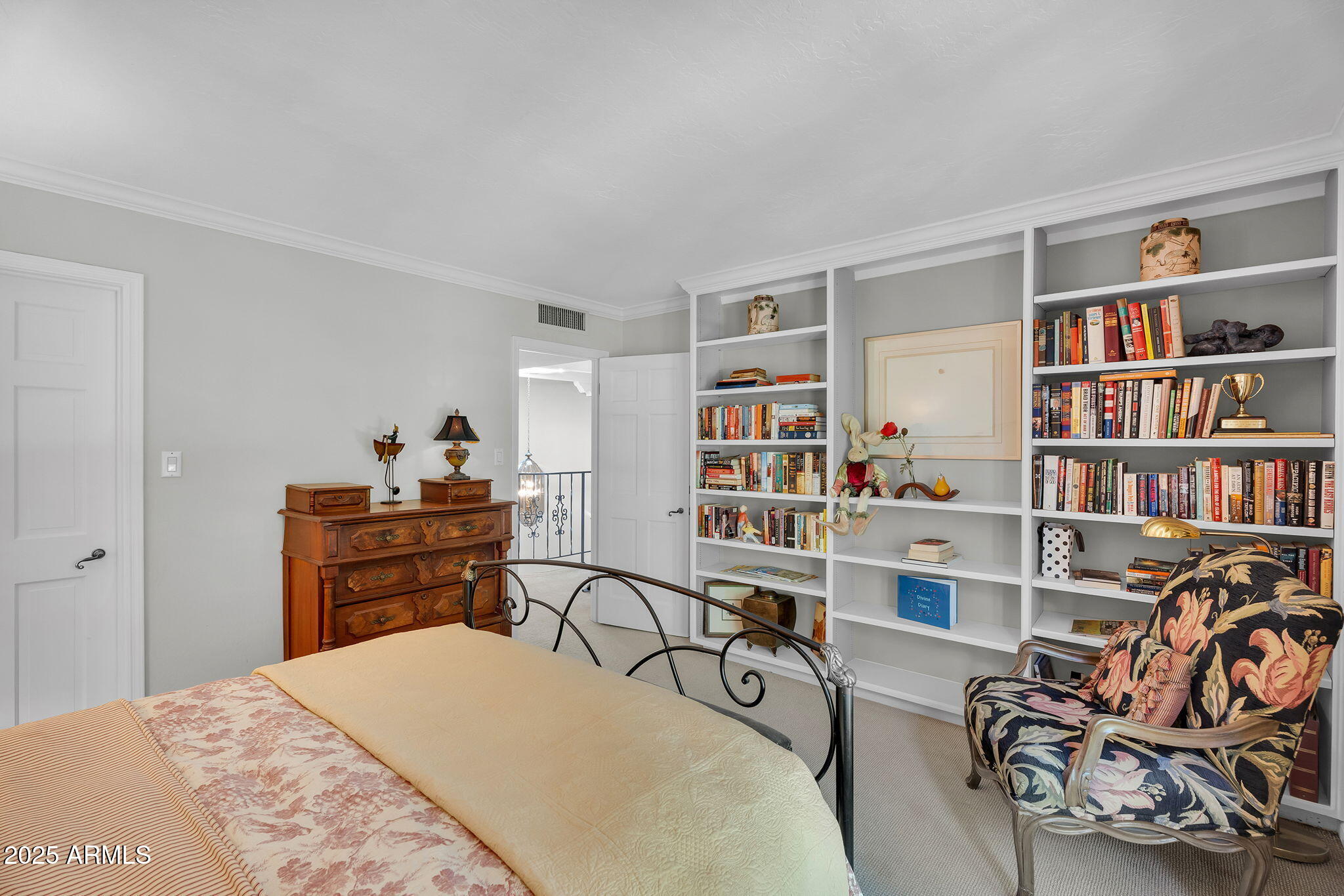 6701 North Scottsdale Road, Unit 16 Scottsdale, AZ 85250 - Photo 54 of 83 a bed room with a bed and a book shelf