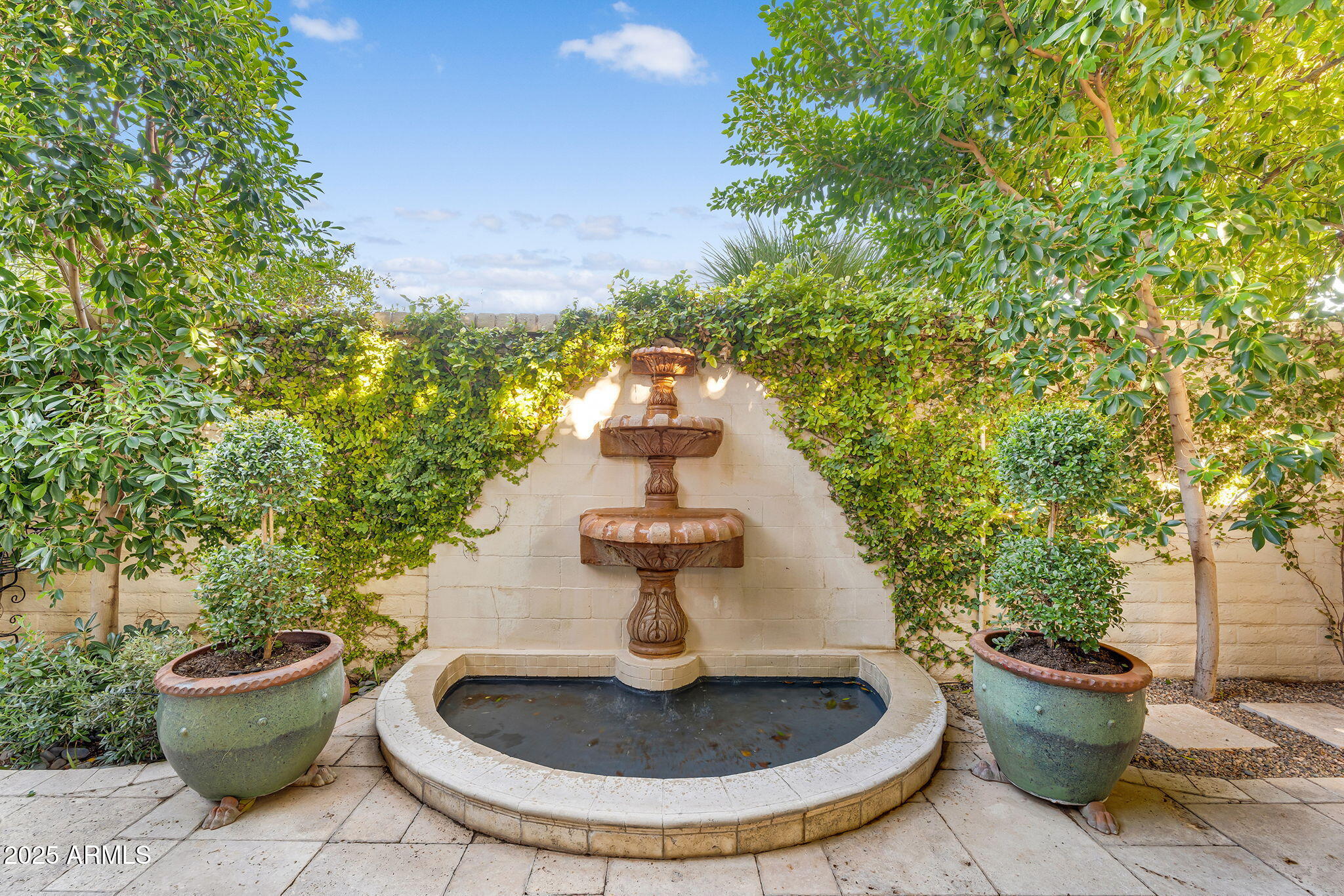 6701 North Scottsdale Road, Unit 16 Scottsdale, AZ 85250 - Photo 69 of 83 a view of a backyard with plants and entertaining space