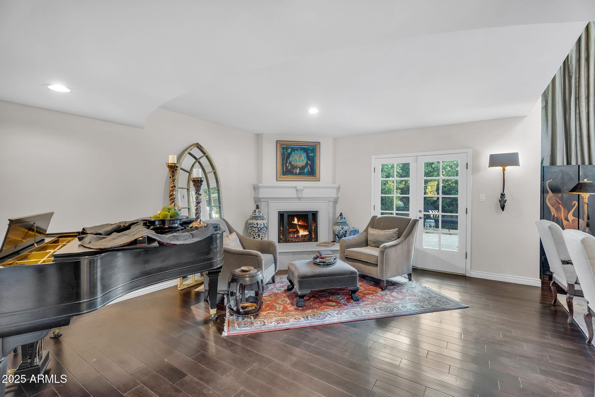 6701 North Scottsdale Road, Unit 16 Scottsdale, AZ 85250 - Photo 7 of 83 a living room with furniture a fireplace and a table
