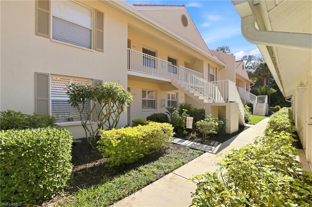 a view of a house with potted plants