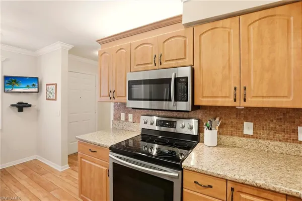 a view of a room with a table and chairs