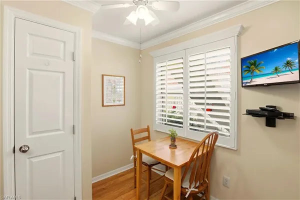 a view of a kitchen with a table and chairs