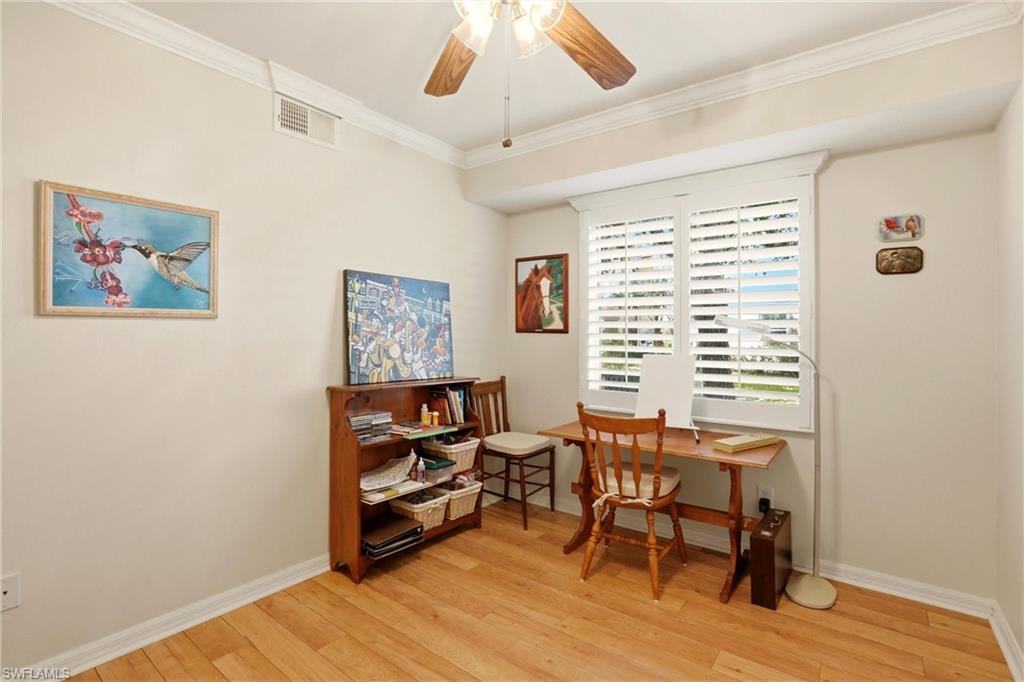 289 Robin Hood Circle, Unit 101 Naples, FL 34104 - Photo 27 of 47 a view of a workspace with furniture and a window