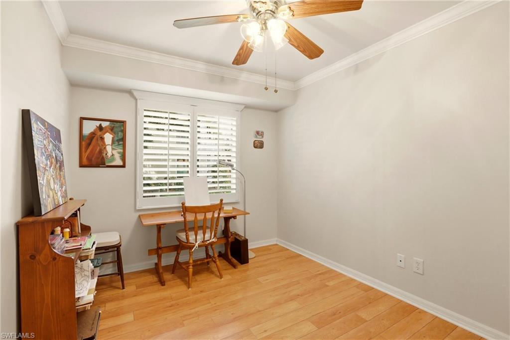289 Robin Hood Circle, Unit 101 Naples, FL 34104 - Photo 28 of 47 a view of a workspace with furniture and a window