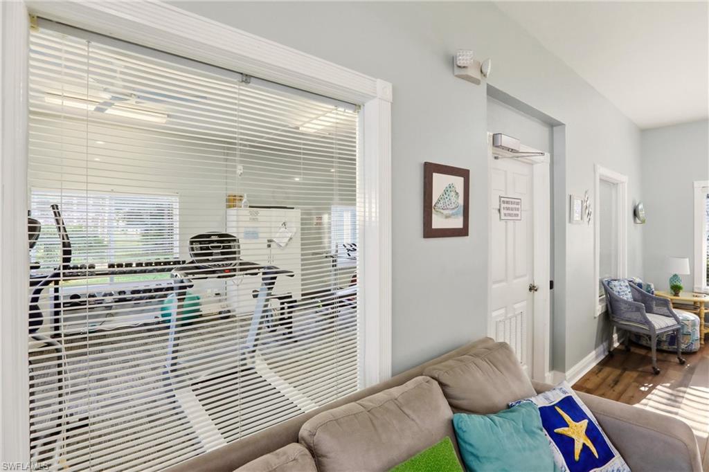 289 Robin Hood Circle, Unit 101 Naples, FL 34104 - Photo 42 of 47 a bedroom with furniture and a window