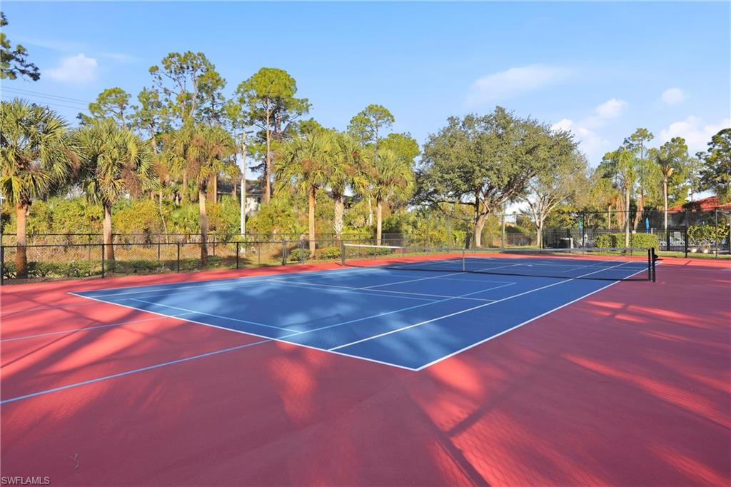 289 Robin Hood Circle, Unit 101 Naples, FL 34104 - Photo 44 of 47 a view of outdoor space tennis court