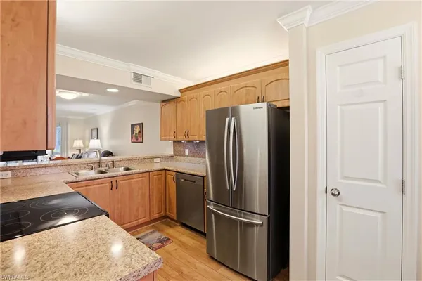 a kitchen with a sink stove and microwave