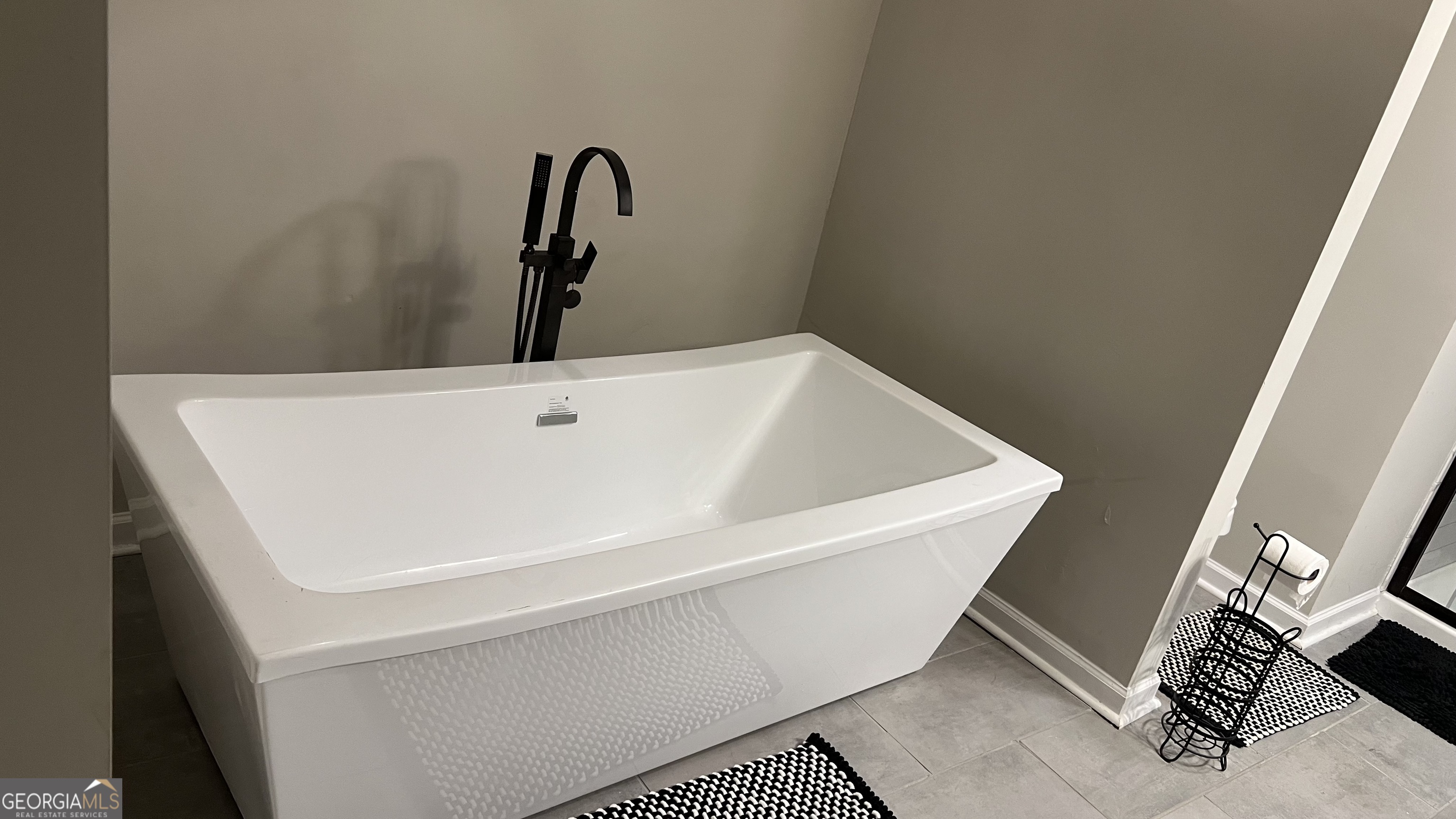 1065 Nathan Jones Road Harlem, GA 30814 - Photo 26 of 32 a white bath tub sitting in a bathroom