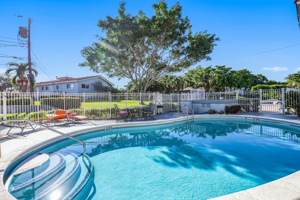 a view of a swimming pool with a patio