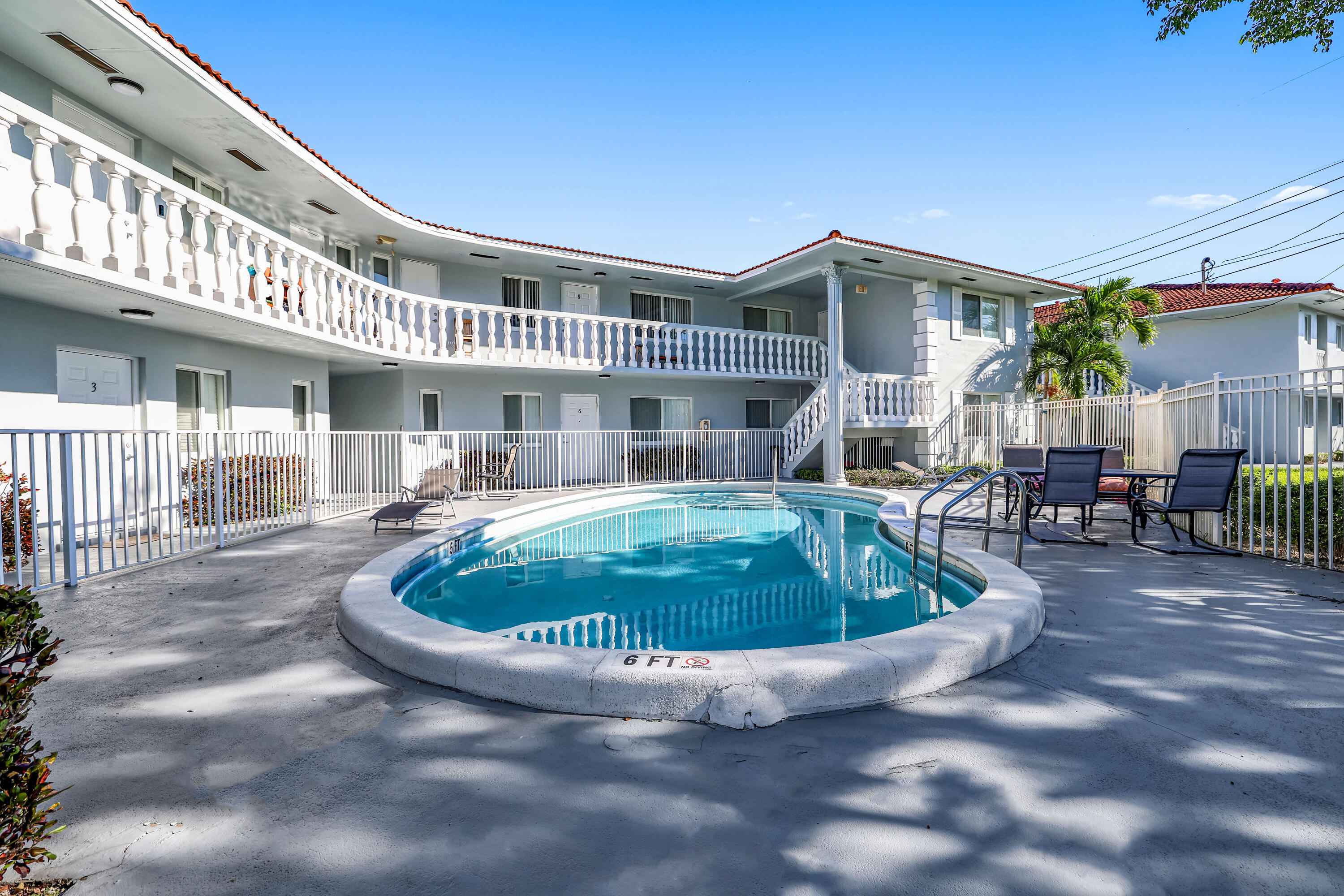 431 West Camino Real Boca Raton, FL 33432 - Photo 2 of 11 a house view with a swimming pool and outdoor seating