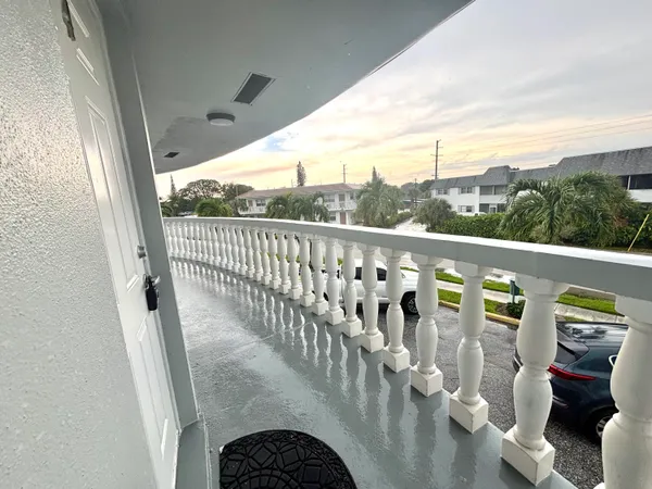 a view of balcony with furniture