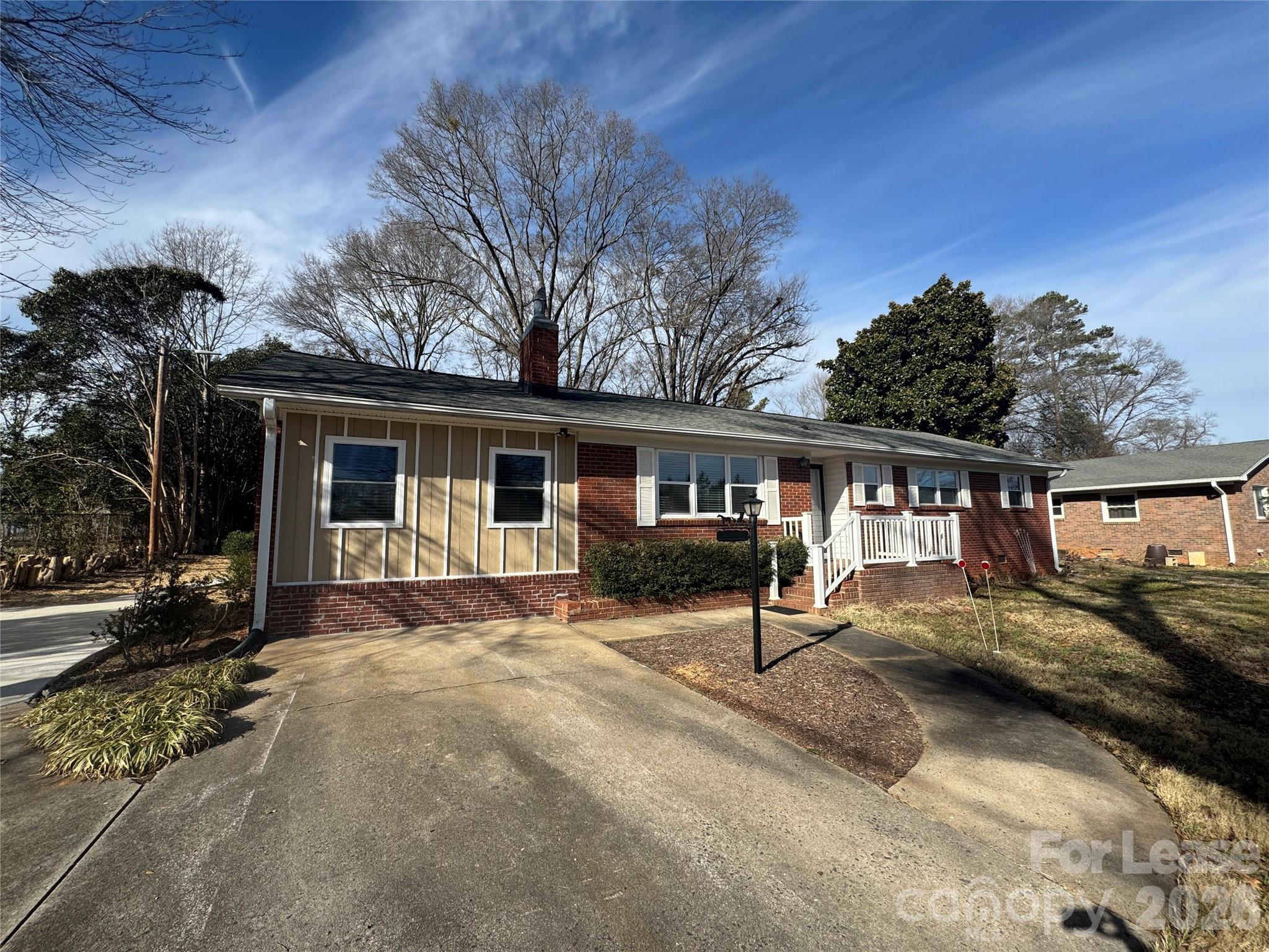 1307 Armstrong Road Belmont, NC 28012 - Photo 1 of 15 a front view of a house with a yard