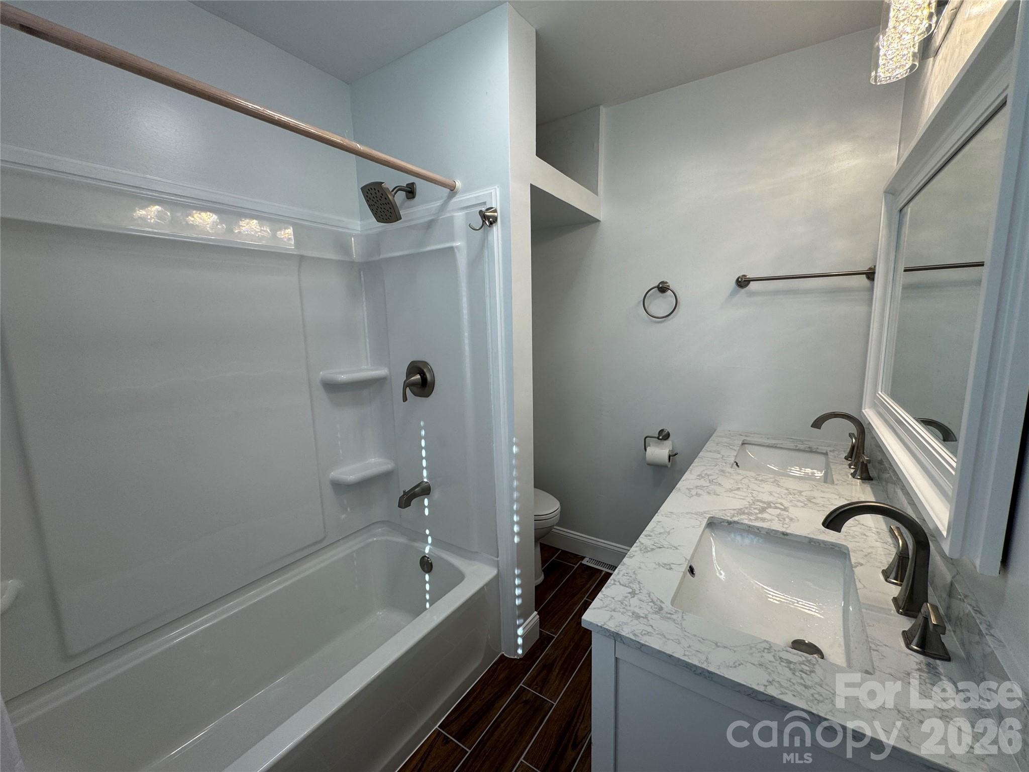 1307 Armstrong Road Belmont, NC 28012 - Photo 11 of 15 a bathroom with a granite countertop sink a toilet and shower
