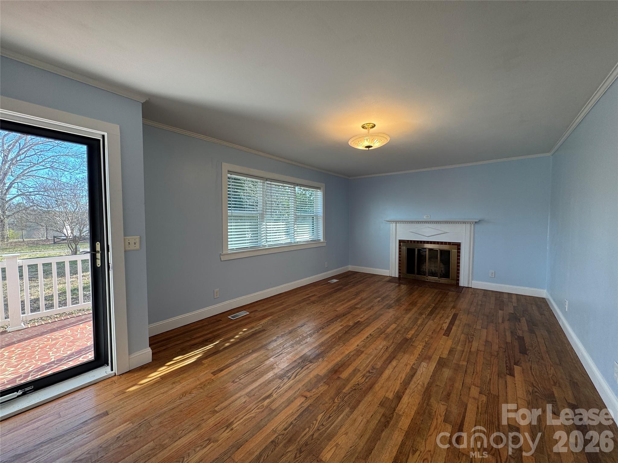 1307 Armstrong Road Belmont, NC 28012 - Photo 3 of 15 a view of empty room with wooden floor and fan