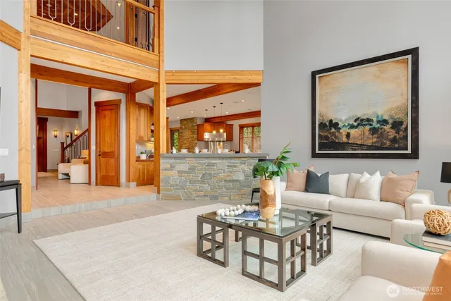 a living room with a table and chairs