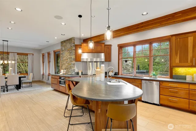 a dining room with furniture a chandelier and wooden floor
