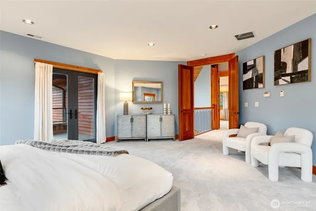 a bed room with a bed and a television