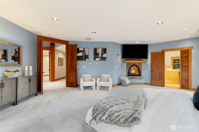 a bathroom with a tub sink and mirror