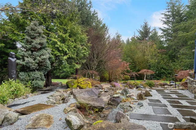 a view of a lake with sitting area