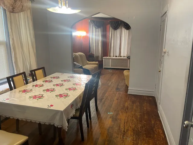 a dining room with furniture and window