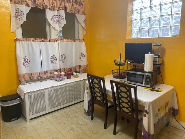 a room with a table and chairs