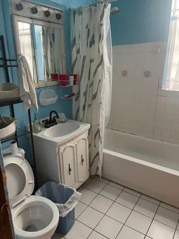 a bathroom with a sink a toilet and a bathtub