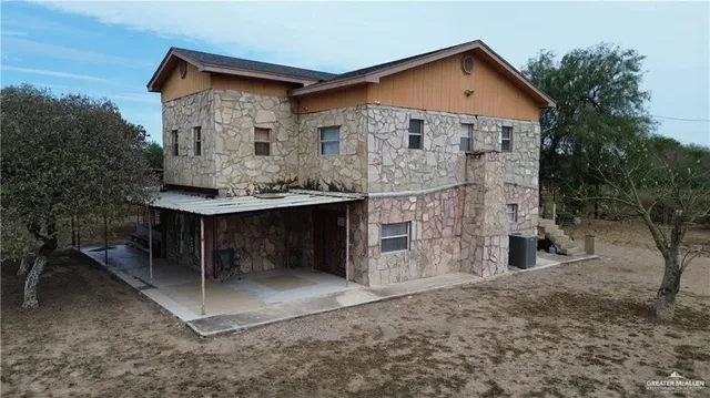 a front view of a house with glass windows