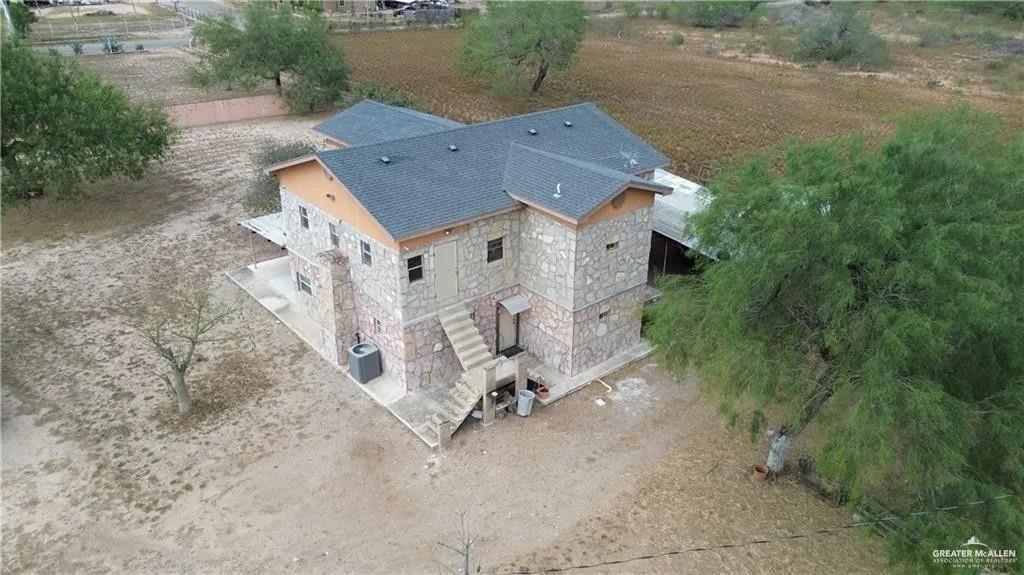 9014 North Abram Road Mission, TX 78574 - Photo 3 of 14 an aerial view of a house with yard and parking space