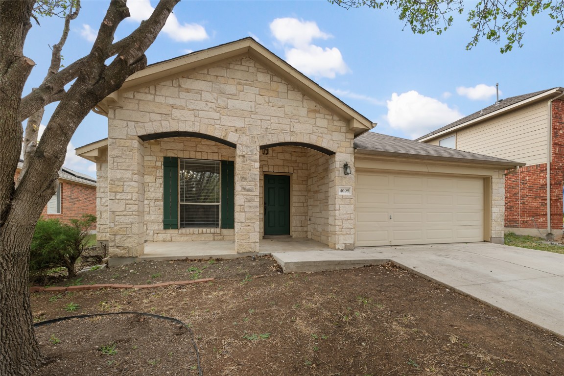 4009 Veiled Falls Drive Pflugerville, TX 78660 - Photo 1 of 26 a front view of a house