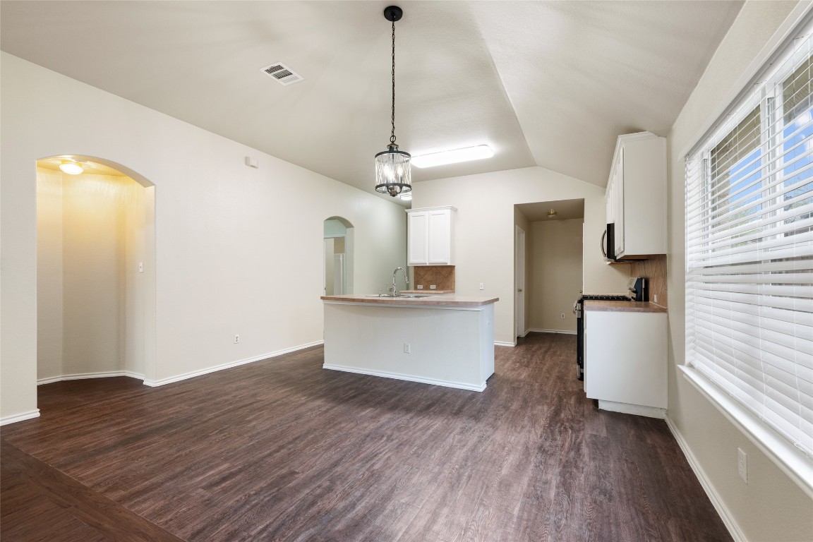 4009 Veiled Falls Drive Pflugerville, TX 78660 - Photo 13 of 26 a kitchen with a refrigerator and a stove top oven