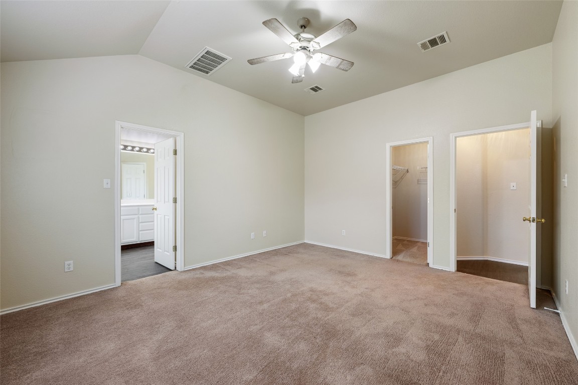 4009 Veiled Falls Drive Pflugerville, TX 78660 - Photo 17 of 26 a view of empty room with a ceiling fan