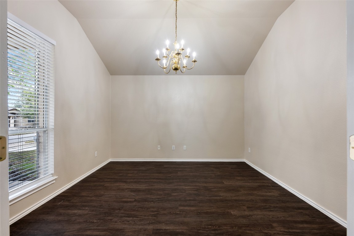 4009 Veiled Falls Drive Pflugerville, TX 78660 - Photo 4 of 26 a view of an empty room with wooden floor and a window