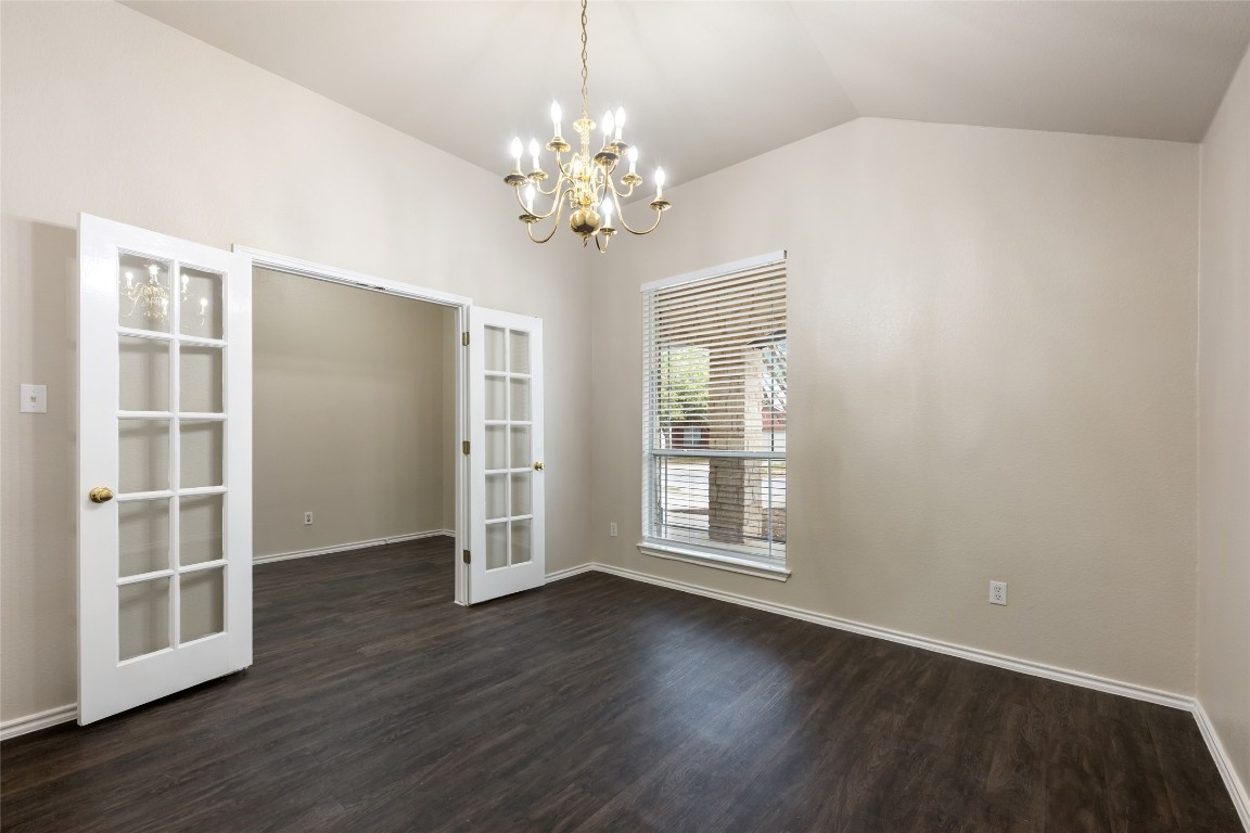 4009 Veiled Falls Drive Pflugerville, TX 78660 - Photo 5 of 26 an empty room with wooden floor and windows
