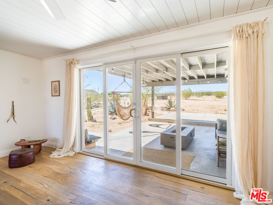 2724 Stonehill Avenue Joshua Tree, CA 92252 - Photo 12 of 65 a living room with hardwood floor and furniture